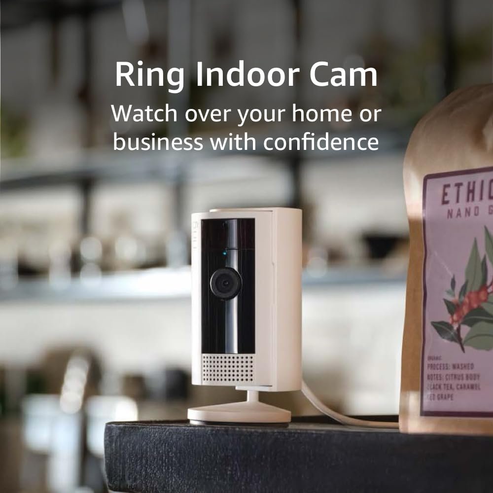 Ring Indoor Cam placed on a shelf, providing live video monitoring and security alerts inside the home.